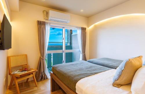 Yonabaru Appartement | オーシャンビュー窓から見える景色を想い出にThe琉球タワー10A