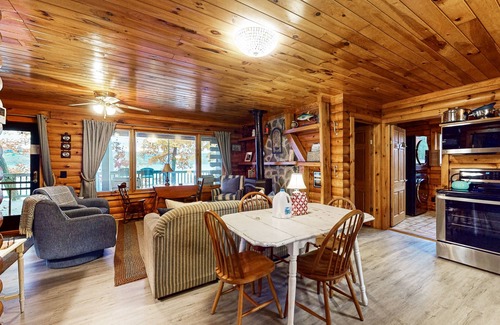 Valois Maison | 1-acre lakefront log cabin with dock, 50 ft water frontage, hot tub, & deck