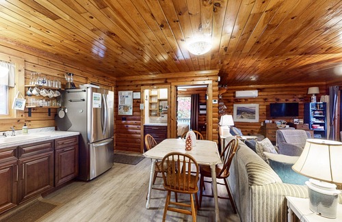 Valois Maison | 1-acre lakefront log cabin with dock, 50 ft water frontage, hot tub, & deck