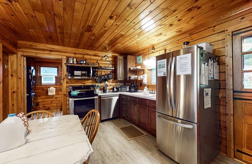 Valois Maison | 1-acre lakefront log cabin with dock, 50 ft water frontage, hot tub, & deck