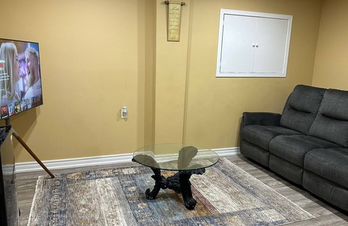 Brampton Maison | 1 bedroom basement suite with spacious living room and laundry, no kitchen.