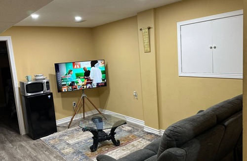Brampton Maison | 1 bedroom basement suite with spacious living room and laundry, no kitchen.