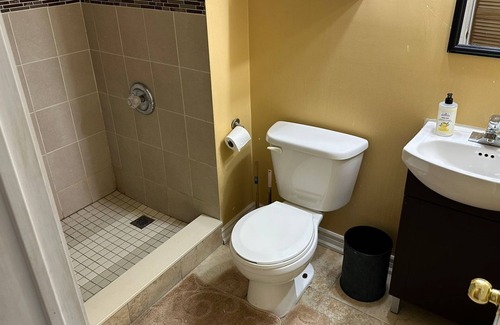 Brampton Maison | 1 bedroom basement suite with spacious living room and laundry, no kitchen.