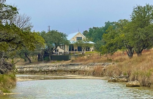Johnson City Maison | 2 bedroom/2 bath stone farmhouse overlooking hill country creek on 50 acres