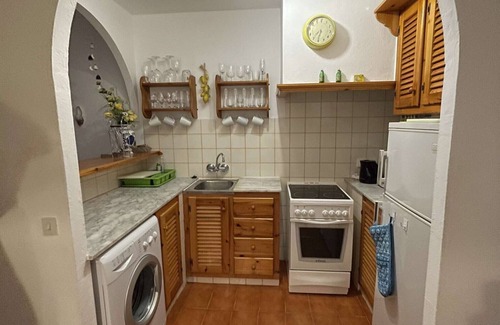 Arenal d'en Castell Appartement | Appartement avec piscine, jardins partagés et vue sur mer