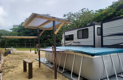 Aguadilla Maison | 2 bedroom camper, minutes from Aguadilla & Isabela beaches with AC and comfort.