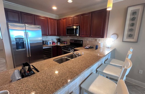 Orange Beach Copropriété | 2 BR at The Wharf Orange Beach pool/lazy river/gym/movie theatre/shops & more!