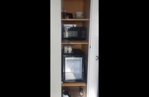Kawaha Point Appartement | 2 Double Beds, 1 Single Bed, 1 Double Sofa Bed in a small 1 bedroom and 1 lounge Studio No Kitchen Only fridge, microwave