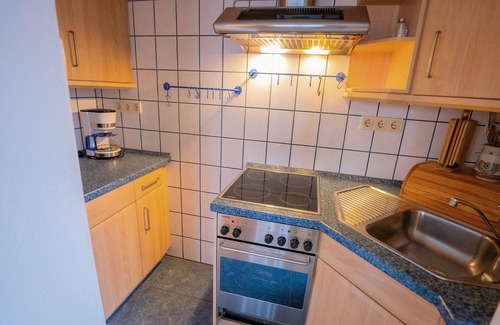 Neuharlingersiel Appartement | 3 room apartment with great lake view, fireplace, terrace and jetty