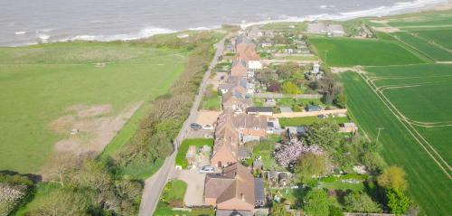 Happisburgh Maison | 4 bed house 50 yards from the beach & lighthouse
