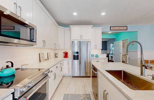Sunset Island Maison | 4-story townhome with resort pools, beaches, water access, & great location