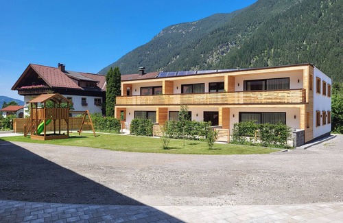 Bichlbach Appartement | 50m² modern vacation apartment with terrace, free bathing lake, 100m to the ski area