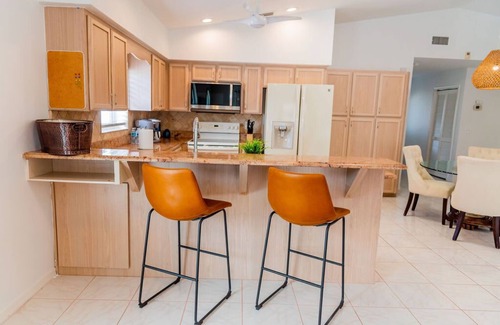 Naples Park Maison | 690 Paradise Shores Oasis | New Heated Pool & Spa