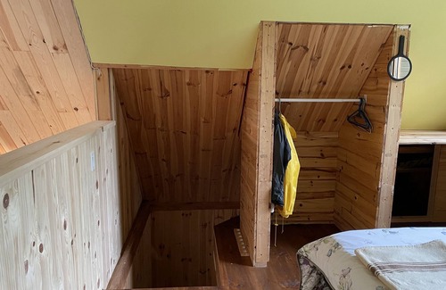 Notre-Dame-Des-Bois Cabine | A cozy rustic mountain side cabin with a small river on the property.