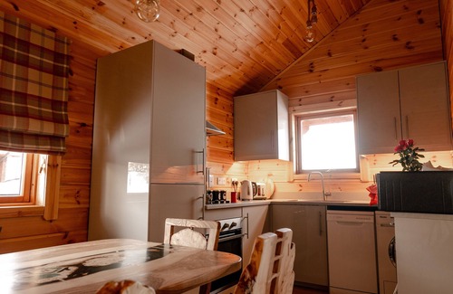 Gorebridge Cabine | A traditional Scandinavian style lodge, with stylish wooden interior decorated with a Scottish theme