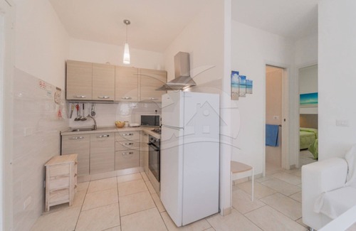 Marina di Campo Appartement | Albero del Pepe 2 with lush garden
