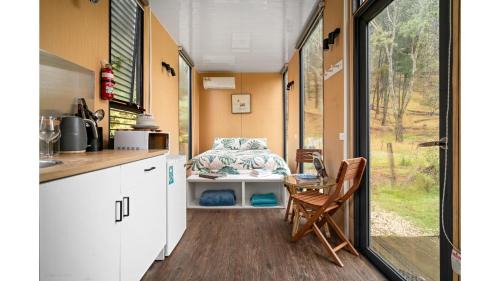 Flowerdale Maison | Alpaca Tiny House with Vineyard Lakeside by Tiny Away