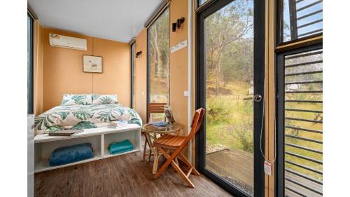 Flowerdale Maison | Alpaca Tiny House with Vineyard Lakeside by Tiny Away