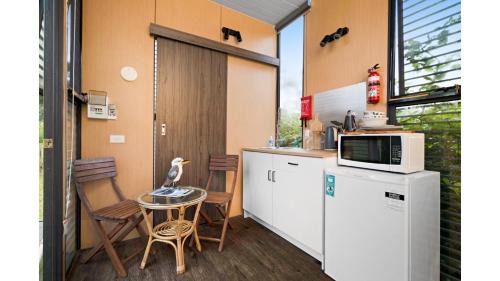 Flowerdale Maison | Alpaca Tiny House with Vineyard Lakeside by Tiny Away