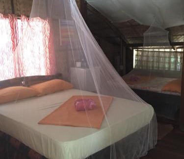 Abra de Ilog Hôtel | Amami Beachfront Bungalows & Villa
