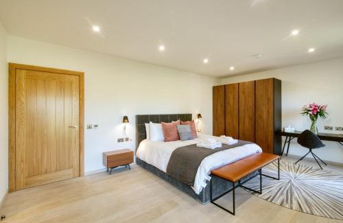 Crianlarich Chalet De Ski | An Caisteal Lodge with cascading waterfall view