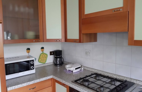 Assenza Appartement | Appartement avec vue sur le lac, piscine, garage et jardin privé