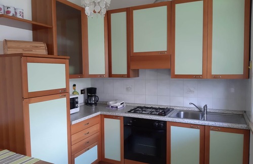 Assenza Appartement | Appartement avec vue sur le lac, piscine, garage et jardin privé