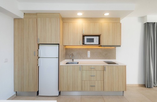 Cala Ferrera Appartement | Appartement 'Aquamarina 7' avec piscine partagée, Wi-Fi et climatisation.