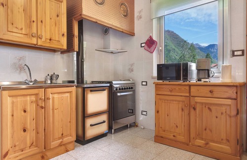 Locca Appartement | Appartement 'Ca' Da Rosetta' avec vue sur montagne, terrasse privée et jardin privé