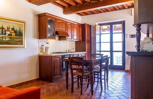 La Pesta Appartement | Appartement "Casa Vacanza Il Carpignone 5" avec vue sur le lac, piscine partagée et jardin