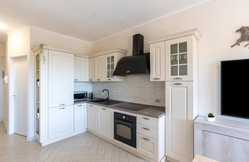 Lesa Appartement | Appartement 'Jacuzzi E Vistalago' avec Vue sur le Lac, Wi-Fi et Climatisation