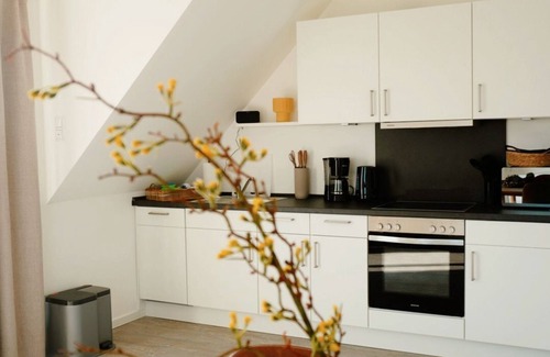 Neuharlingersiel Appartement | Apartment KÖÖK III Heimathafen - modern, balcony, close to the beach