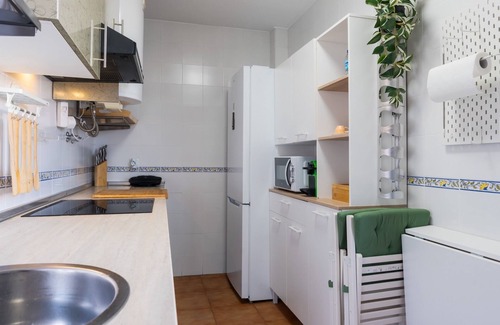 Pilas Appartement | Appartement 'Pilas' avec piscine partagée, Wi-Fi et climatisation