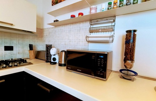 Camin Appartement | Appartement "Résidence royale" avec jardin partagé, Wi-Fi et climatisation