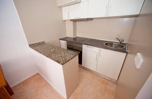 Santa Eulalia del Rio Appartement | Appartement Ses Veles 2 dormitorios près de la plage avec vue sur mer, piscine, Wi-Fi et jardin