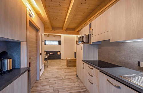 Predazzo Appartement | Appartement "Vacanze Arcobaleno - Giallo" avec vue sur la montagne, sauna et bain à remous