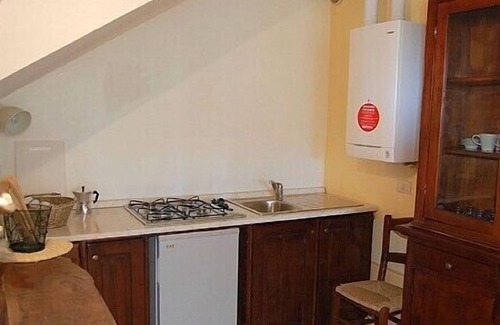 Montone Maison | Appartement Aria A: Un appartement caractéristique entouré de prairies et de collines verdoyantes.