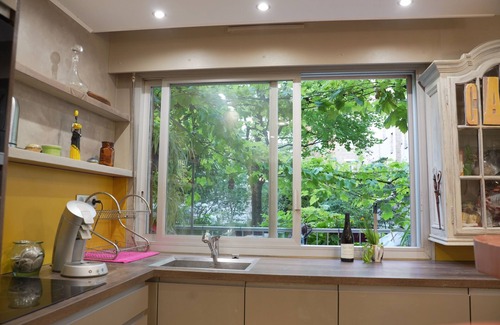Batignolles Appartement | Appt + terrasse sur jardin 4 personnes face métro et parc Luther king