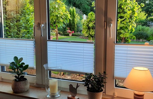 Annweiler am Trifels Copropriété | Arrive and feel at home! First floor apartment with a view of the garden paradise