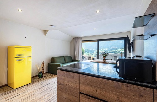 Fie allo Sciliar Appartement | Appartement AUMIA Opal avec vue sur les montagnes, balcon et Wi-Fi.