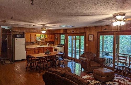 Harrisonville Cabine | Backyard creek, screened porch