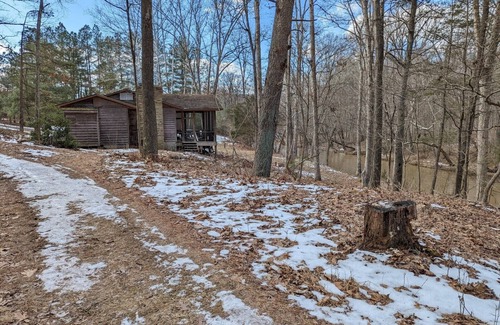Harrisonville Cabine | Backyard creek, screened porch