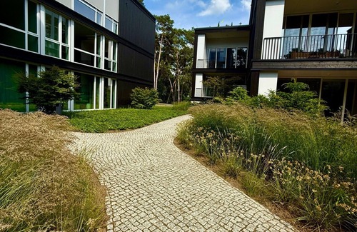 Bad Saarow Appartement | Bad Seerose, cozy vacation apartment with lake view, roof terrace, pool and sauna