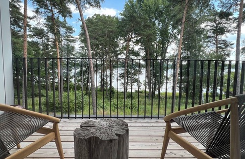 Bad Saarow Appartement | Bad Seerose, cozy vacation apartment with lake view, roof terrace, pool and sauna