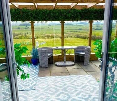 Cronberry Maison | Barlosh Barony Tpod Lodge Ayrshire, elec jacuzzi, BBQ, Firepit, Pizza Oven, indoor outdoor terrace with amazing views, spacious inside and out