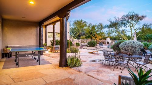 Desert View Village Maison | Barwick is a private oasis Practice on the putting green shoot pool and enjoy this city getaway.