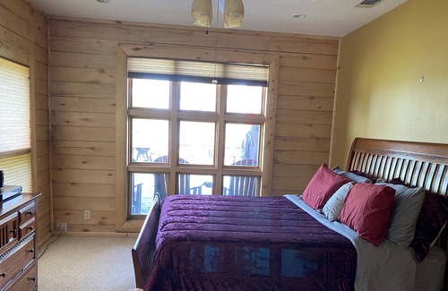 Broaddus Maison | Beautiful Lakefront Log Cabin that will take your breath away.