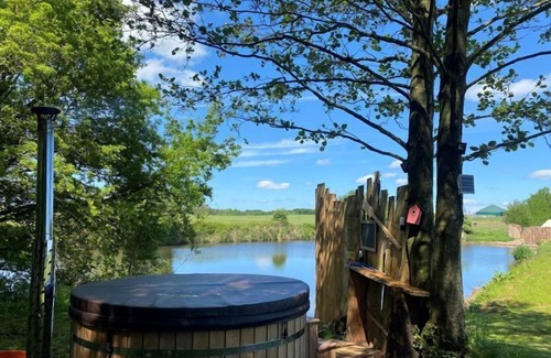 Washford Cabine | Bell tent in ultimate luxury with a wood fired hot tub, super king size bed