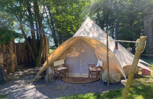 Washford Cabine | Bell tent in ultimate luxury with a wood fired hot tub, super king size bed