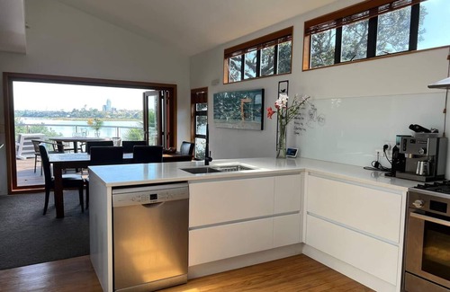 Bayswater Maison | Waterfront paradise with stunning views, spa pool, and paddle boarding.